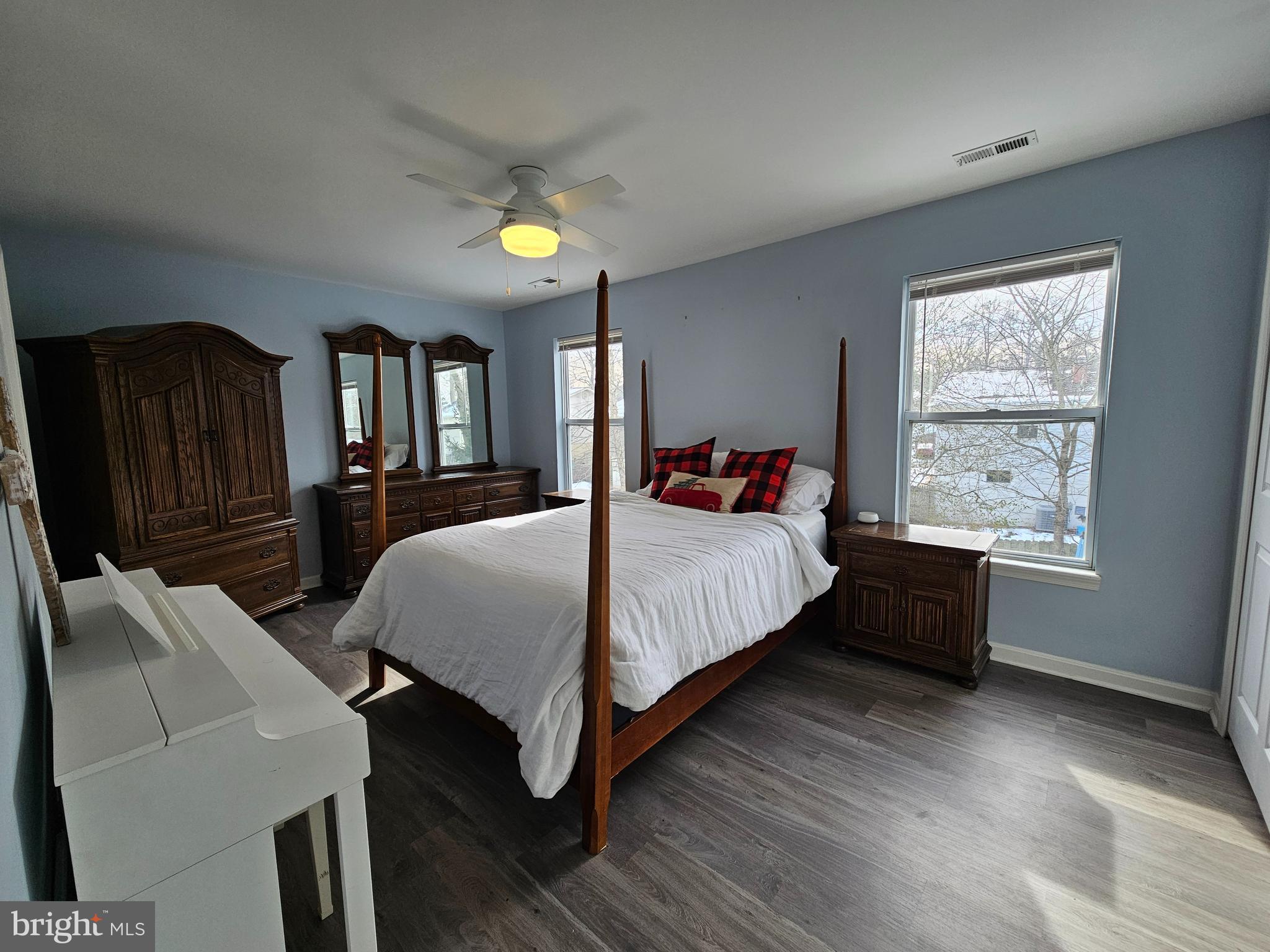 413 Cedar Grove Road Edgewater, MD 21037 - Photo 12 of 30 a bedroom with a bed a dresser with wooden floor