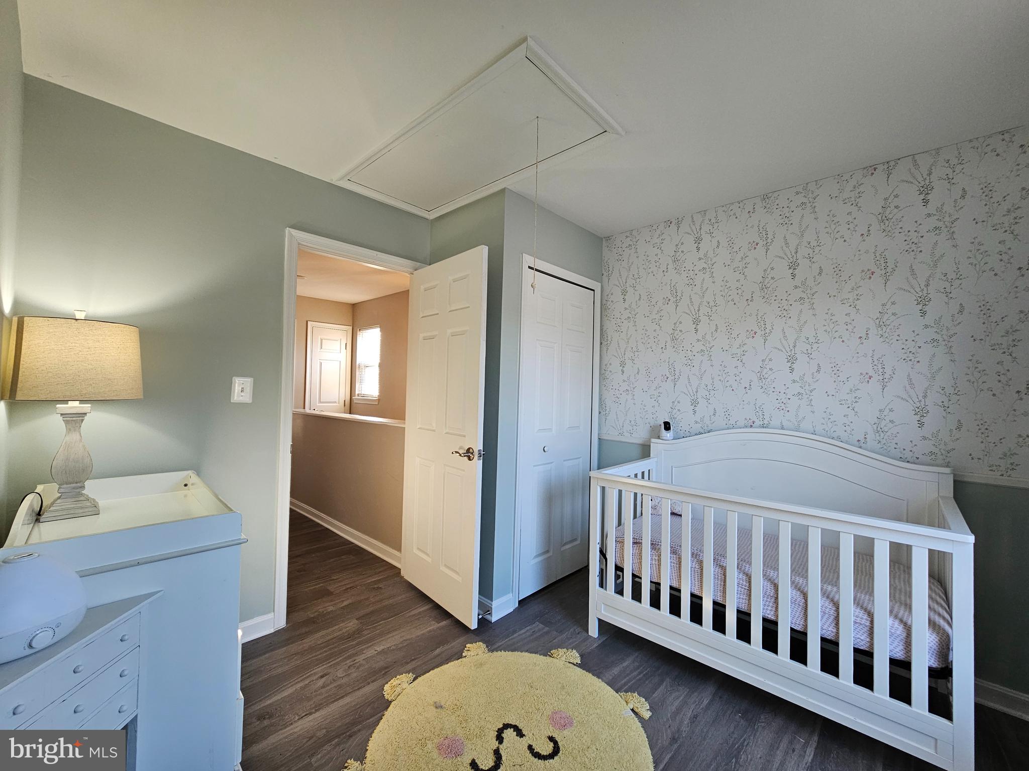 413 Cedar Grove Road Edgewater, MD 21037 - Photo 16 of 30 a bedroom with a bed and wooden floor