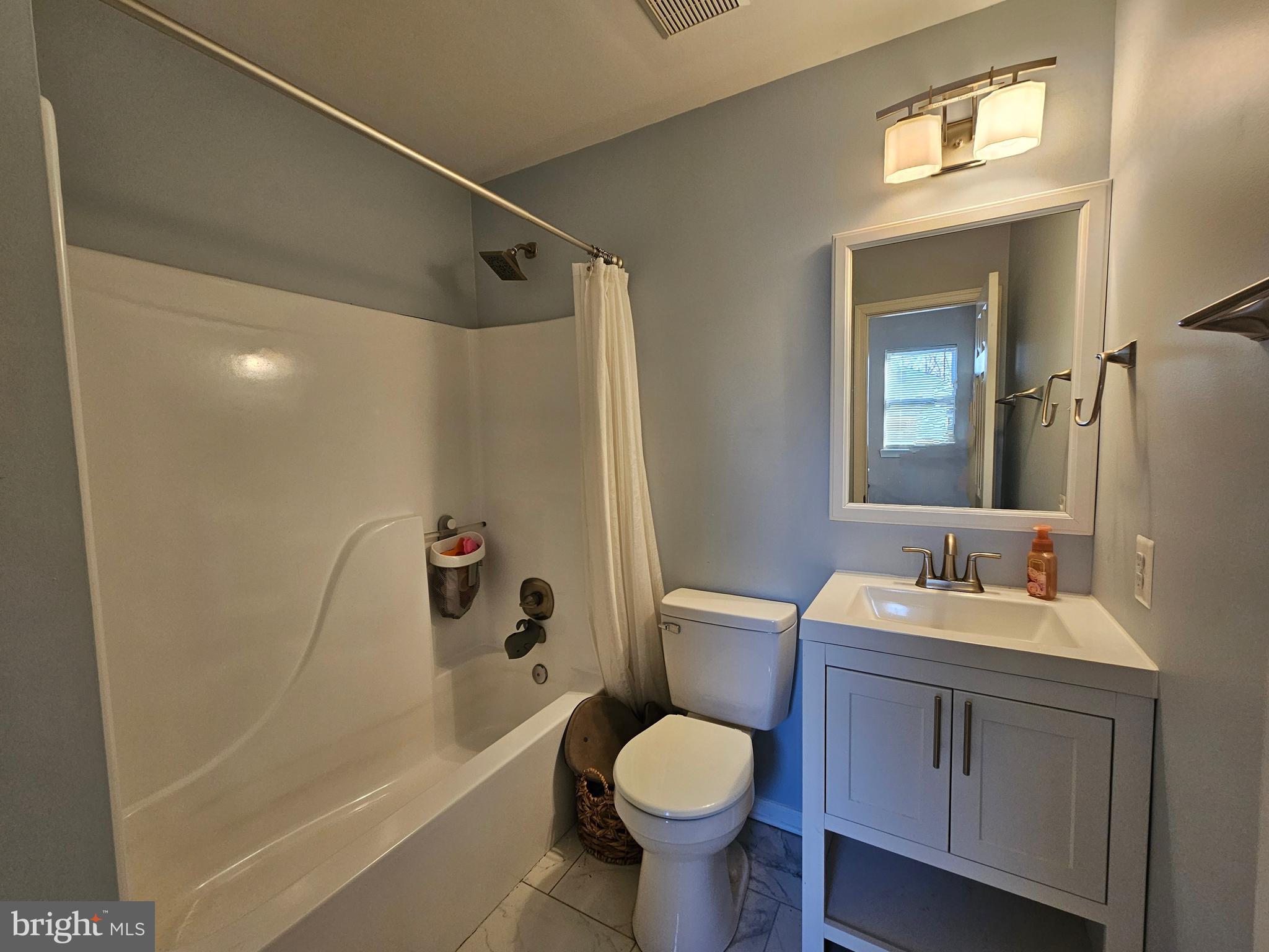 413 Cedar Grove Road Edgewater, MD 21037 - Photo 19 of 30 a bathroom with a sink toilet and shower