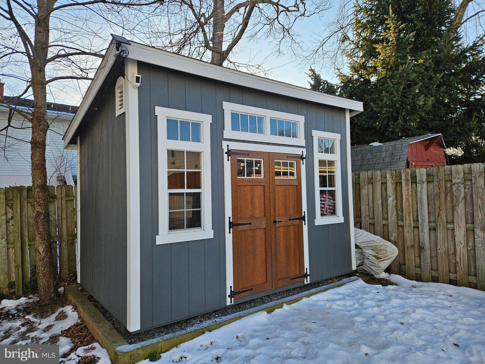413 Cedar Grove Road Edgewater, MD 21037 - Photo 23 of 30 a view of a house with a small yard and wooden fence
