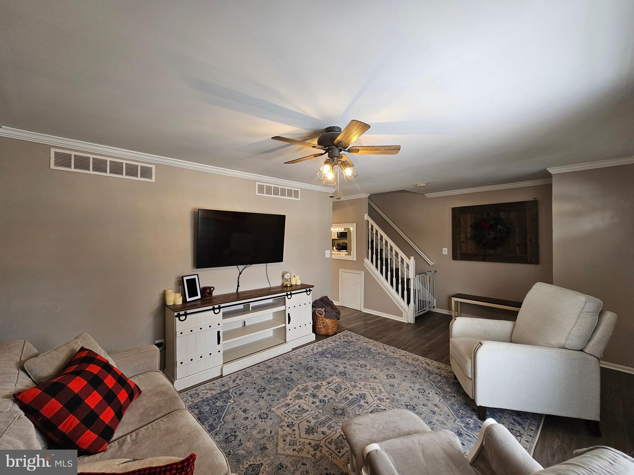 413 Cedar Grove Road Edgewater, MD 21037 - Photo 10 of 30 a living room with furniture and a flat screen tv