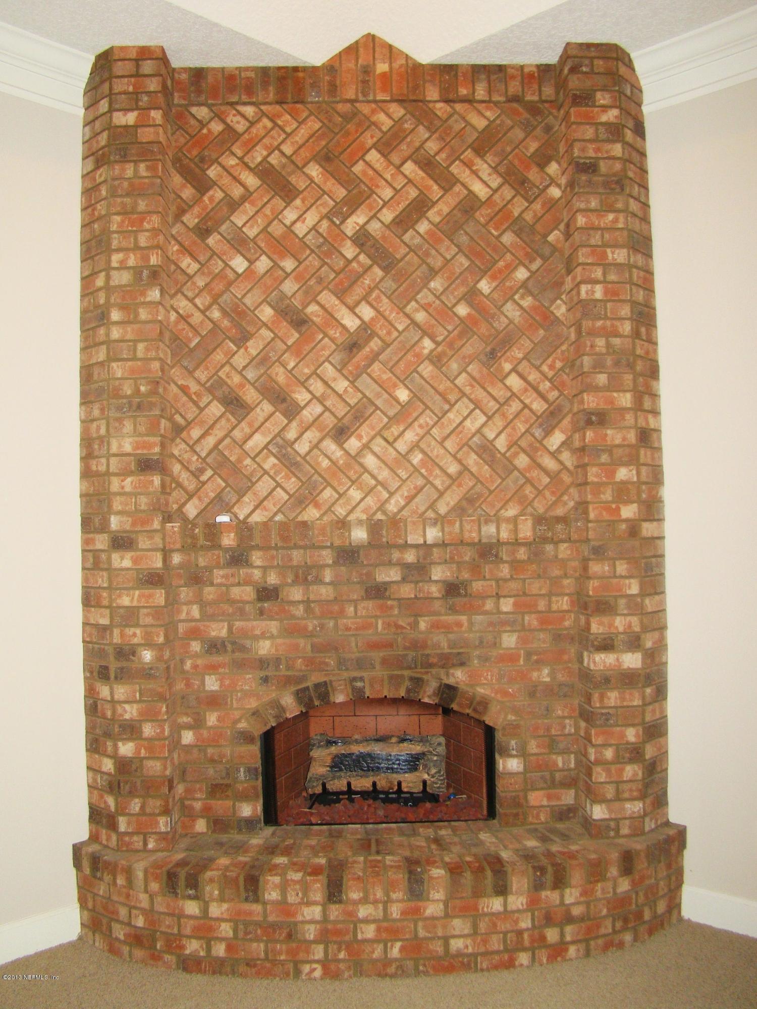 2870 Ravines Road Middleburg, FL 32068 - Photo 26 of 32 FIREPLACE IN FAMILY ROOM