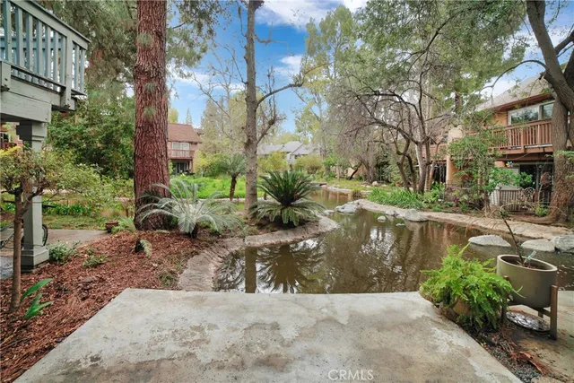 a view of a lake with a yard