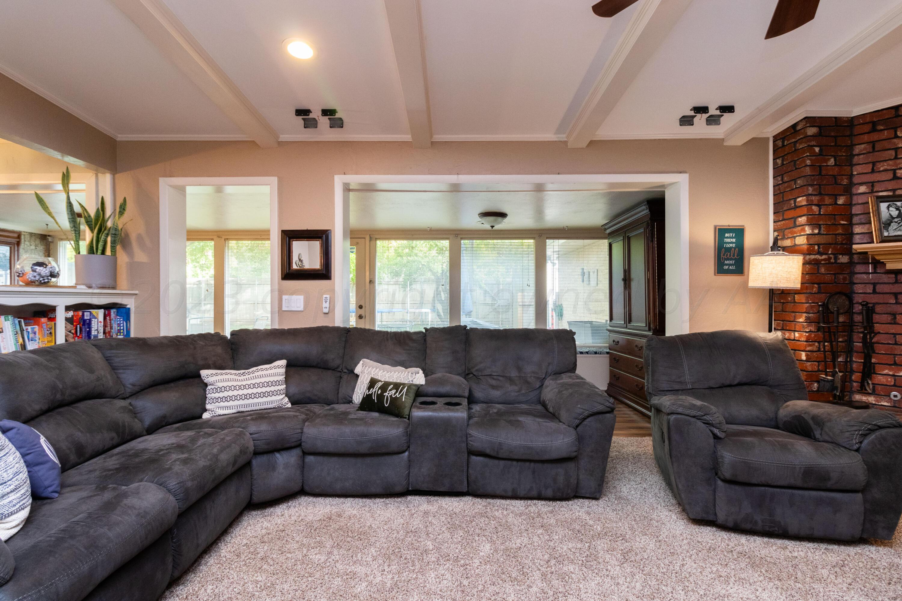 6704 Elmhurst Road Amarillo, TX 79106 - Photo 11 of 40 a living room with furniture and a large window