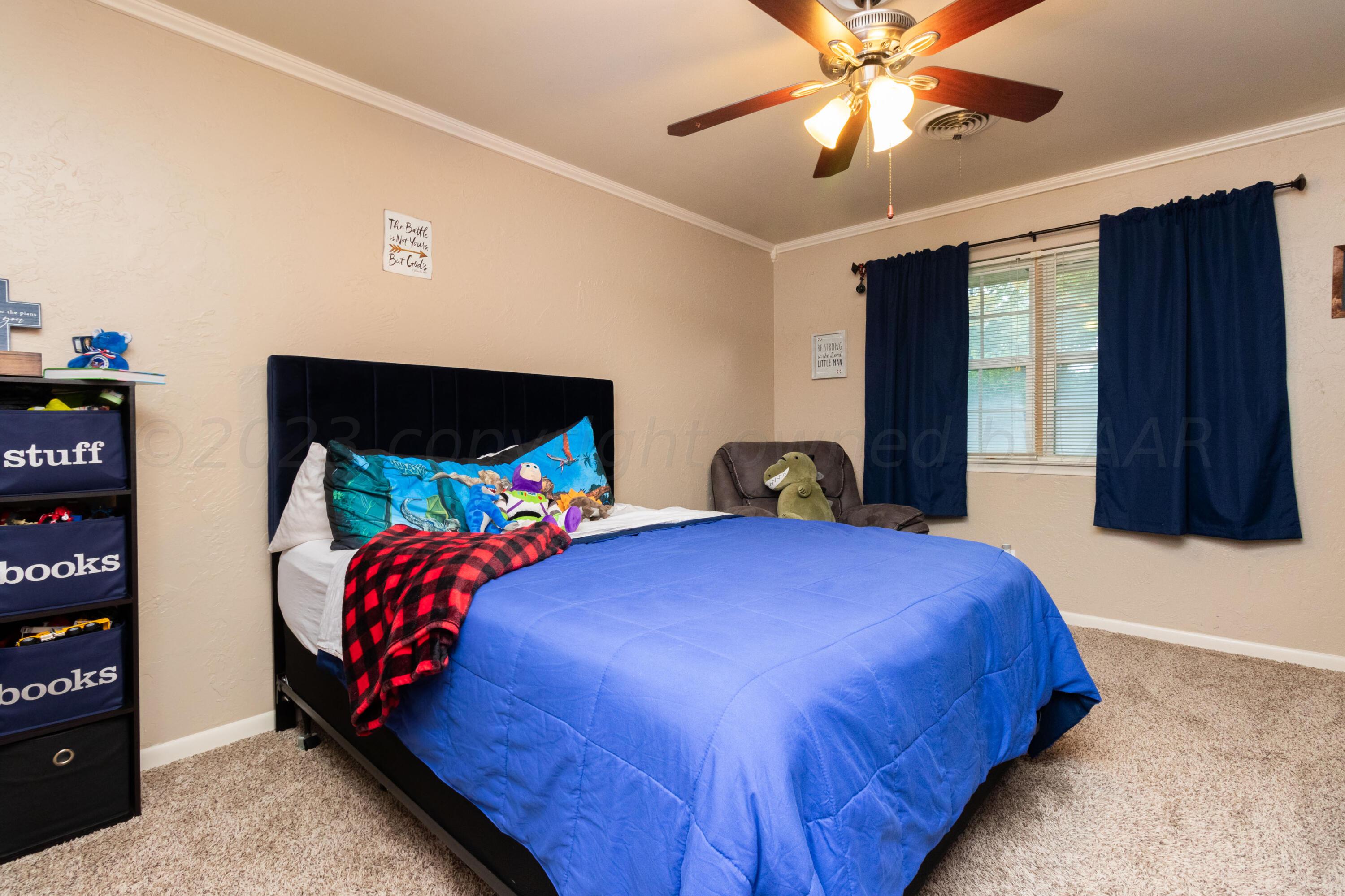 6704 Elmhurst Road Amarillo, TX 79106 - Photo 21 of 40 a bedroom with a bed and a window