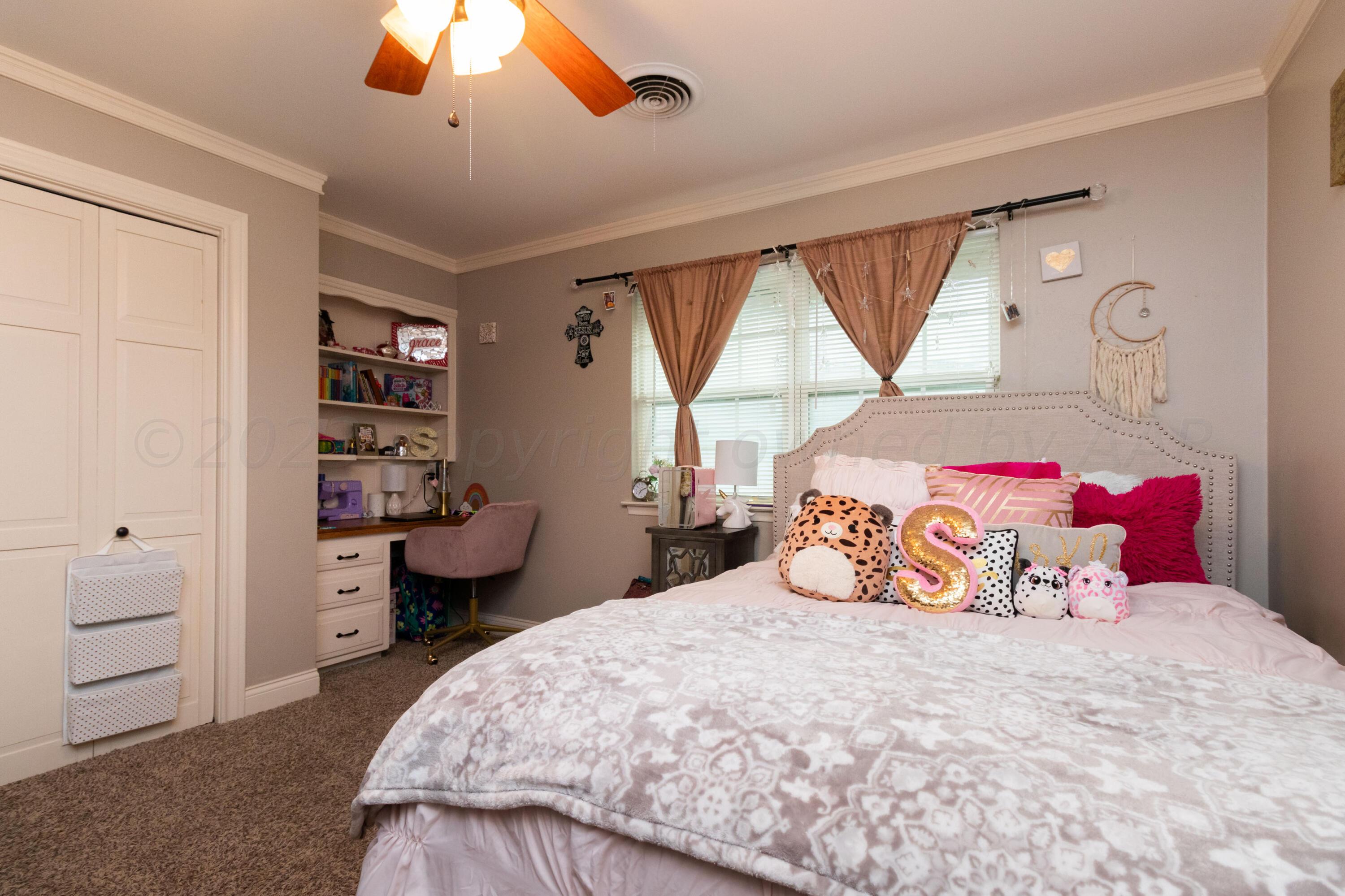 6704 Elmhurst Road Amarillo, TX 79106 - Photo 24 of 40 a bedroom with a large bed and a window