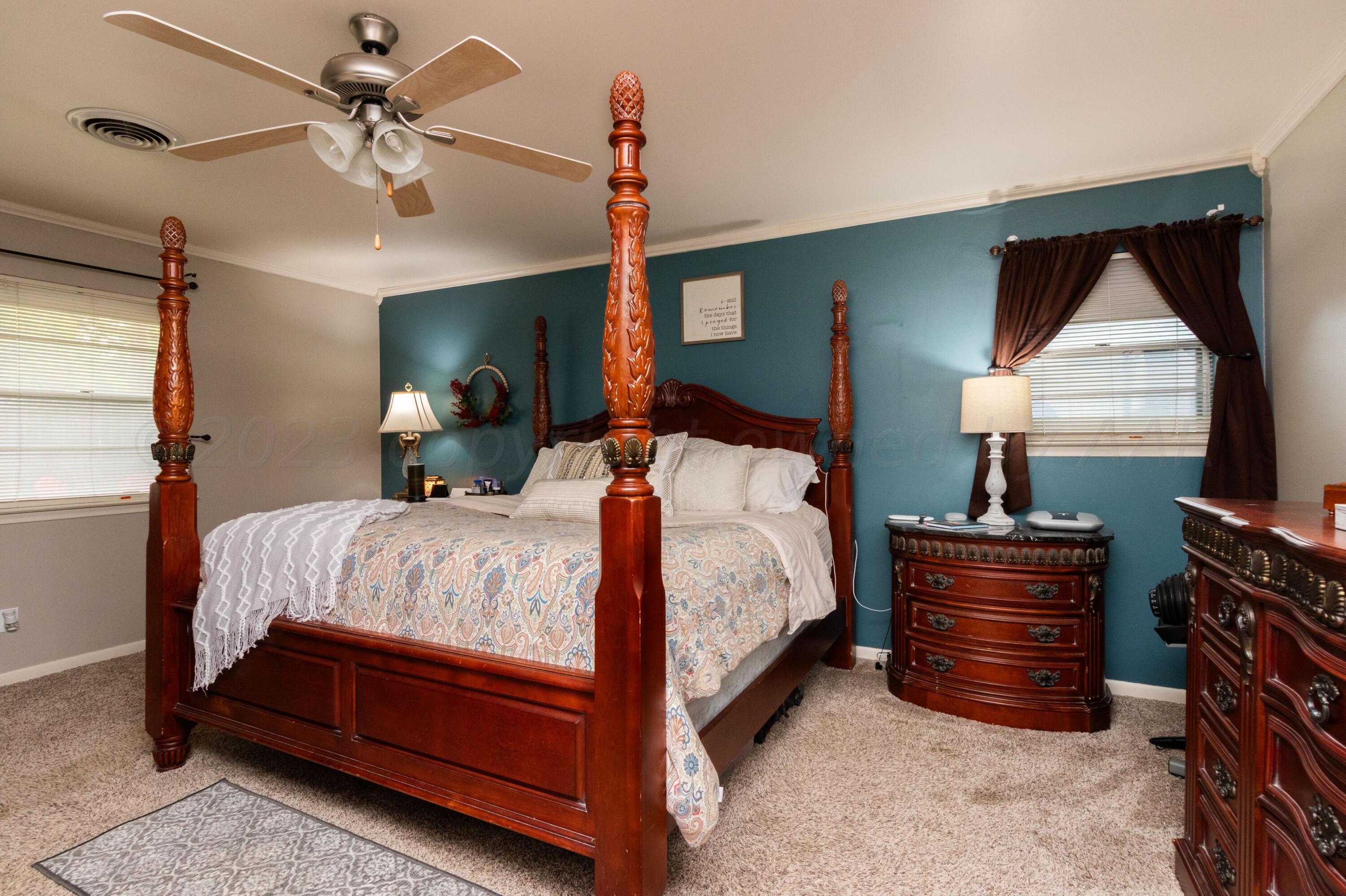 6704 Elmhurst Road Amarillo, TX 79106 - Photo 26 of 40 a bed room with a bed and a window