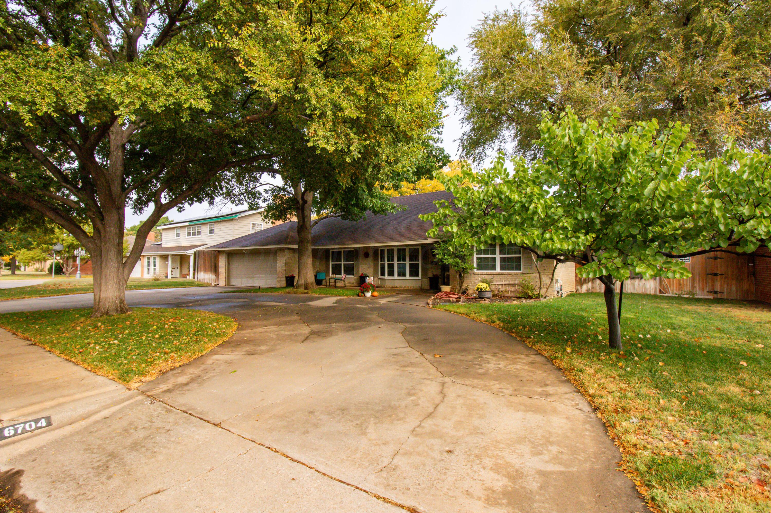 6704 Elmhurst Road Amarillo, TX 79106 - Photo 3 of 40 a view of a house with a yard