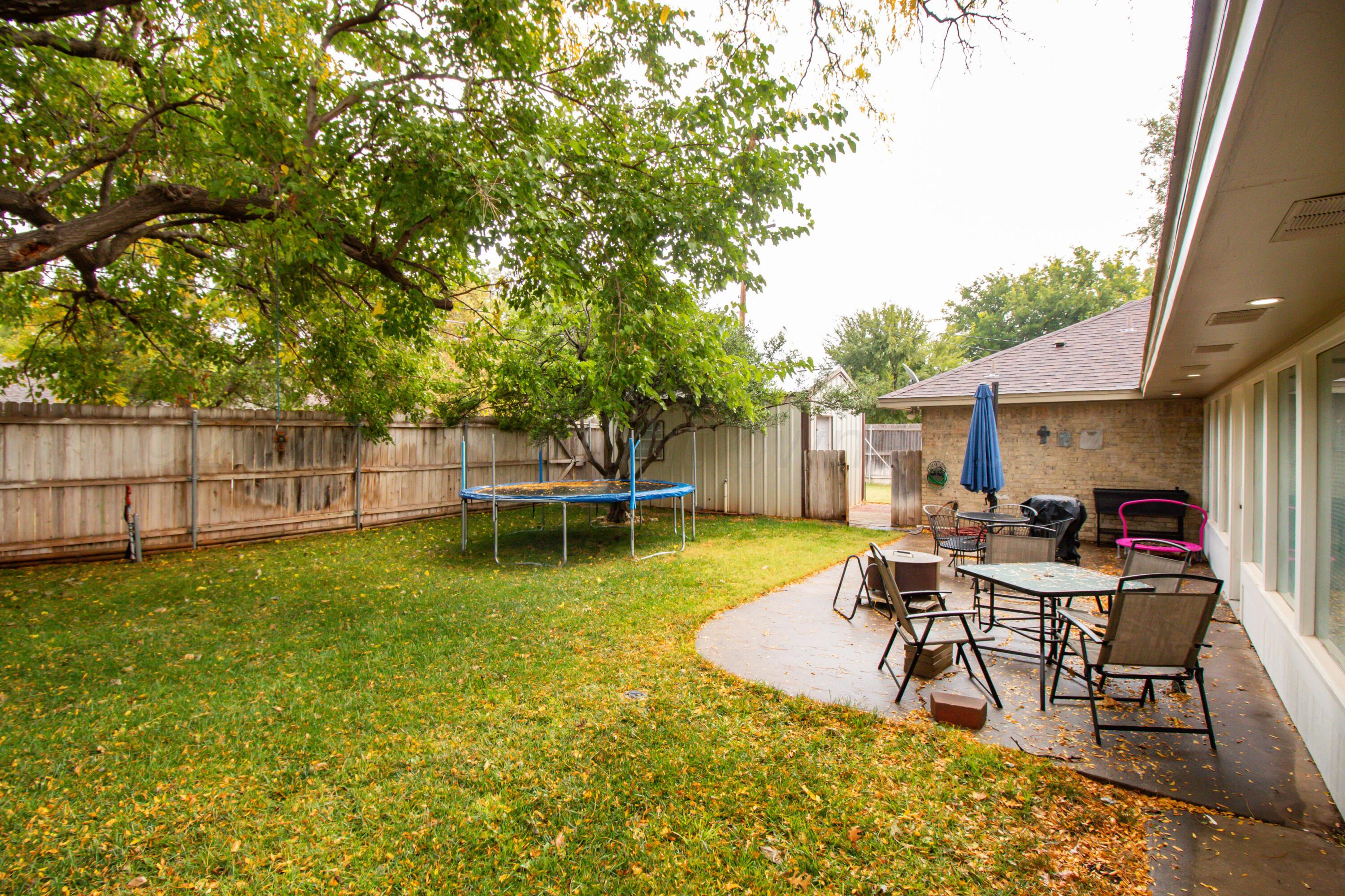 6704 Elmhurst Road Amarillo, TX 79106 - Photo 34 of 40 a view of a house with swimming pool and sitting area