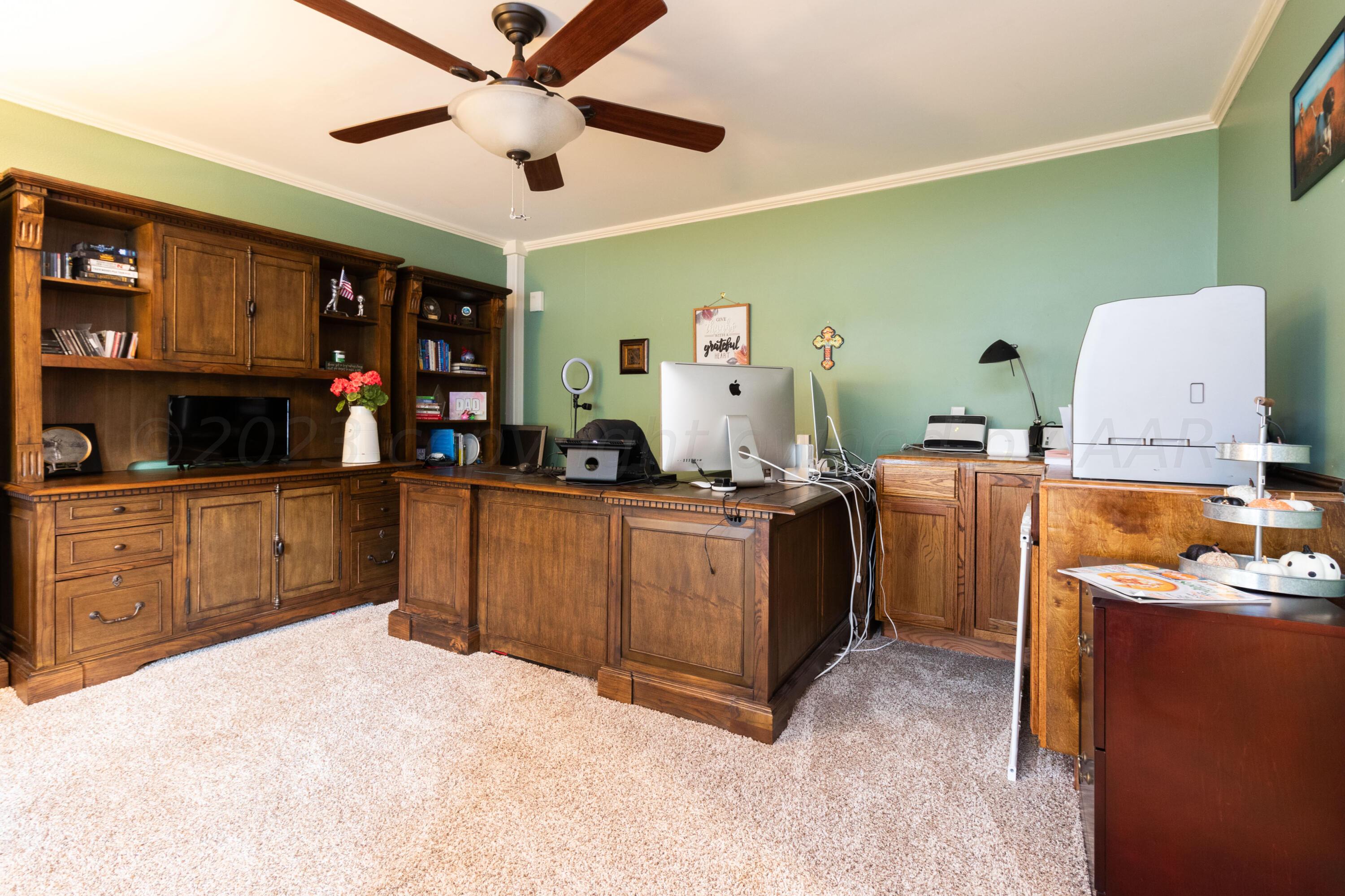 6704 Elmhurst Road Amarillo, TX 79106 - Photo 5 of 40 a kitchen with cabinets and window