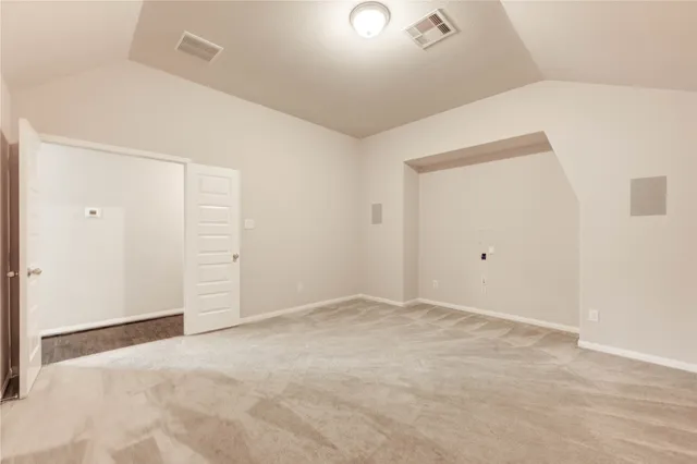 an empty room with closet area