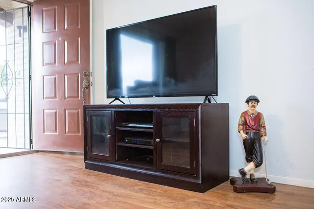 a view of kitchen with stainless steel appliances and cabinets