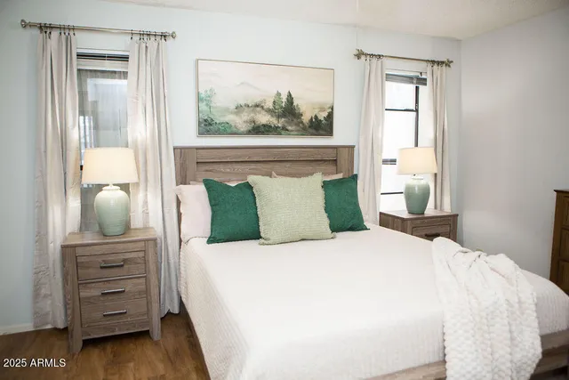 a bedroom with a bed and a dresser