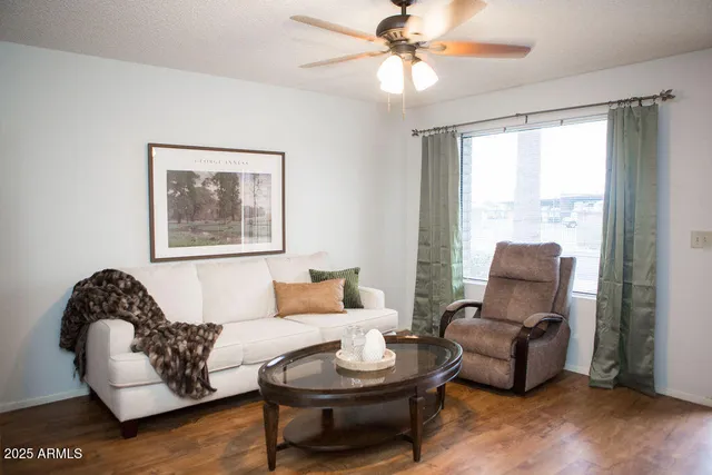 a living room with furniture and a window