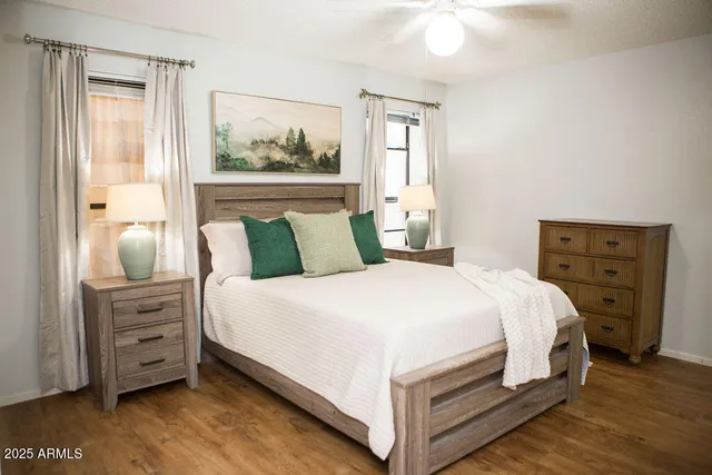 a bedroom with a bed and a dresser