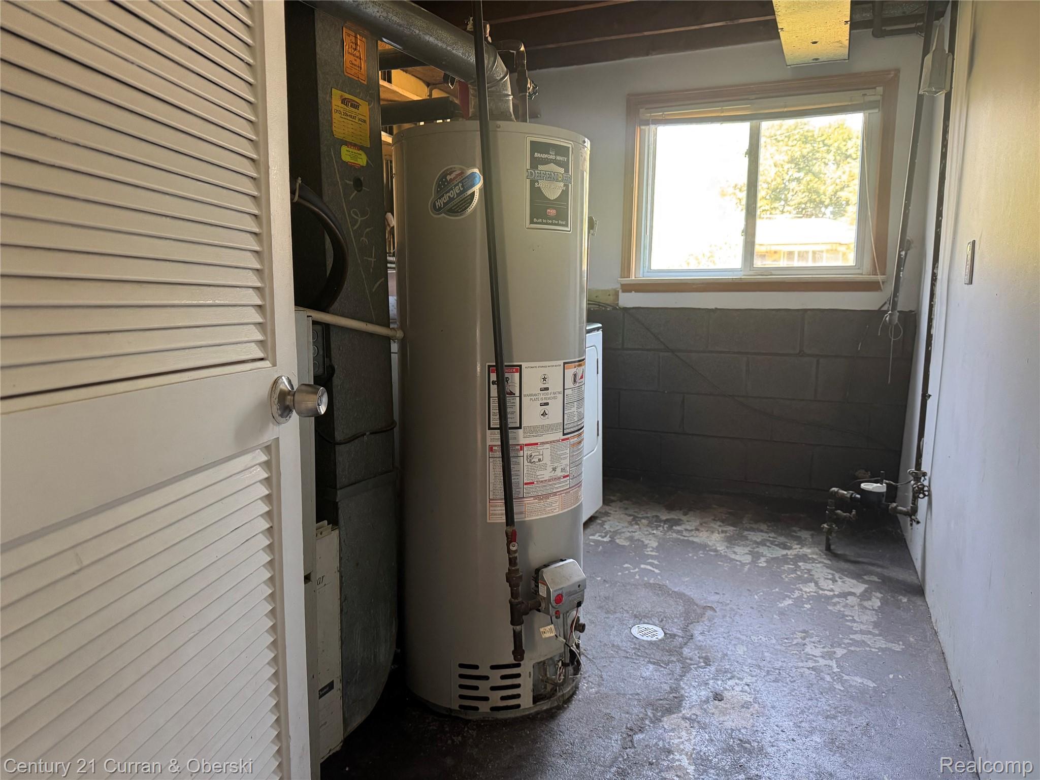 27095 Colgate Street Inkster, MI 48141 - Photo 24 of 24 Utility room featuring a water heater, furnace, and a single window with wood trim