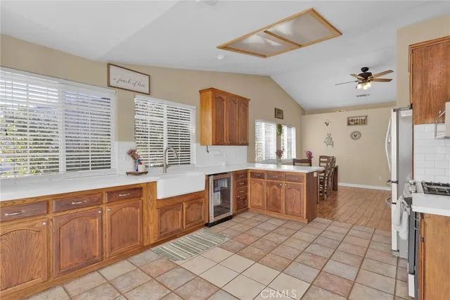 a large kitchen with cabinets and wooden floor