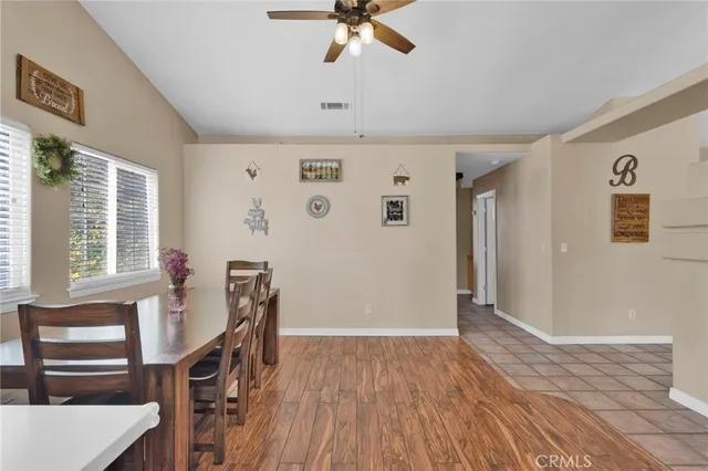 a view of a livingroom with furniture and staircase