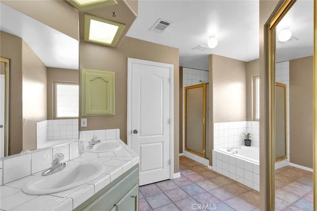 a bathroom with a bathtub and a sink