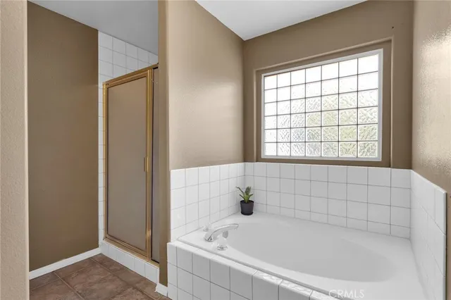 a bathroom with a bathtub and window