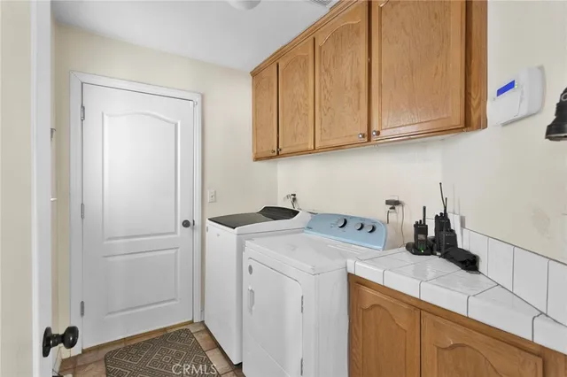 a view of a storage and utility room with a sink