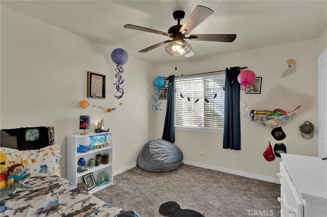 a living room with lots of furniture and a flat screen tv