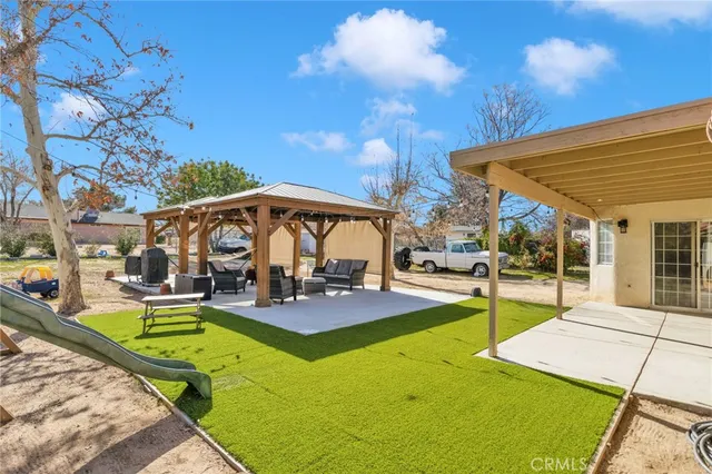 a view of a backyard with swimming pool