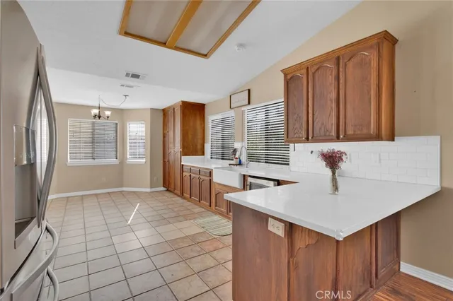 a kitchen with a sink cabinets and window