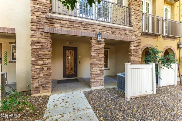 a view of livingroom with furniture flat screen tv and windows