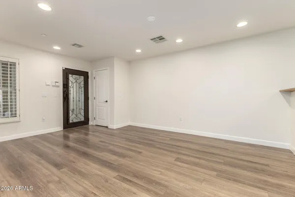 a kitchen with stainless steel appliances granite countertop wooden cabinets and a stove top oven
