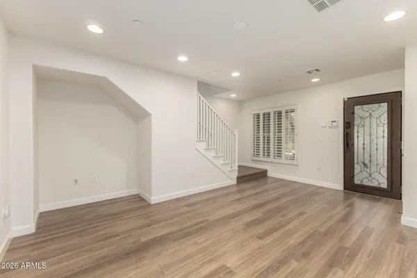 a bathroom with a white bath tub and a toilet