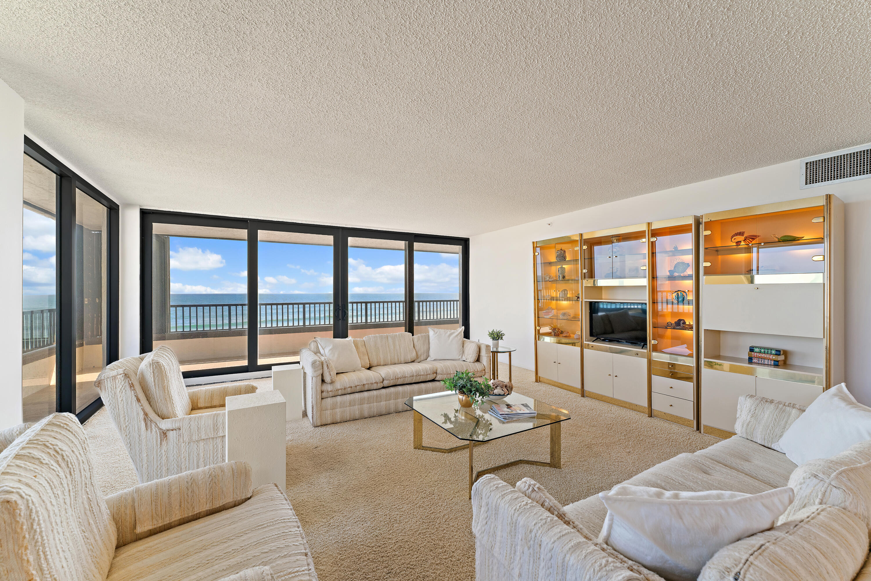 19900 South Beach Road, Unit 601 Jupiter, FL 33469 - Photo 12 of 84 a living room with furniture and large windows