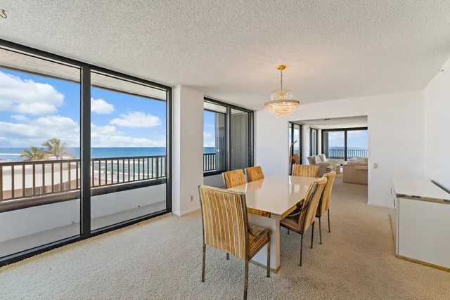 a spacious bedroom with a large bed and a large window