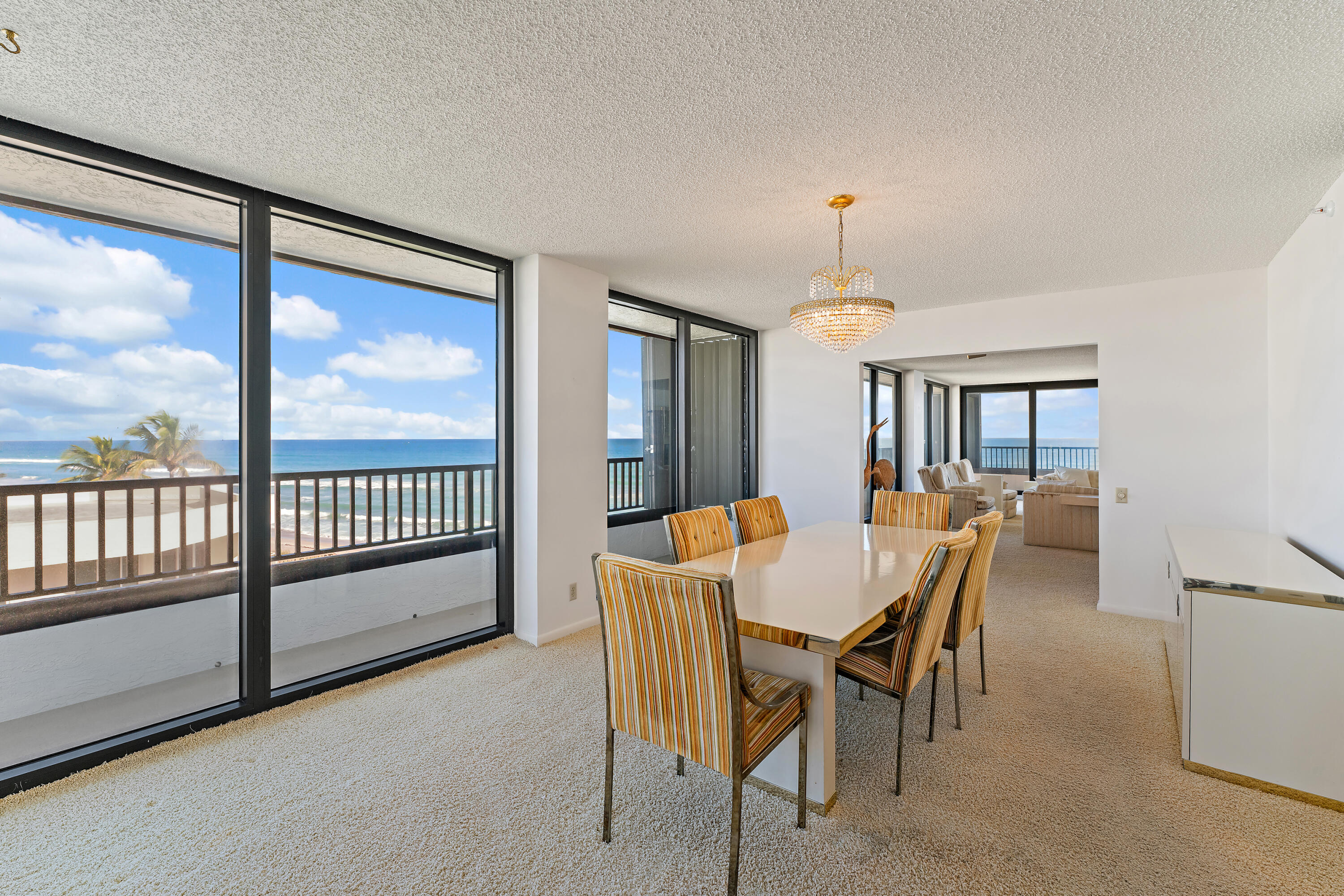 19900 South Beach Road, Unit 601 Jupiter, FL 33469 - Photo 25 of 84 a view of a dining room with furniture window and wooden floor