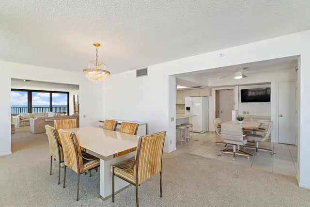 a bedroom with a large bed and a large window