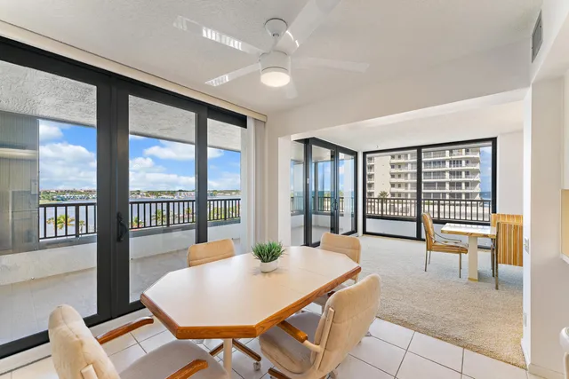 a spacious bedroom with a bed and a large window