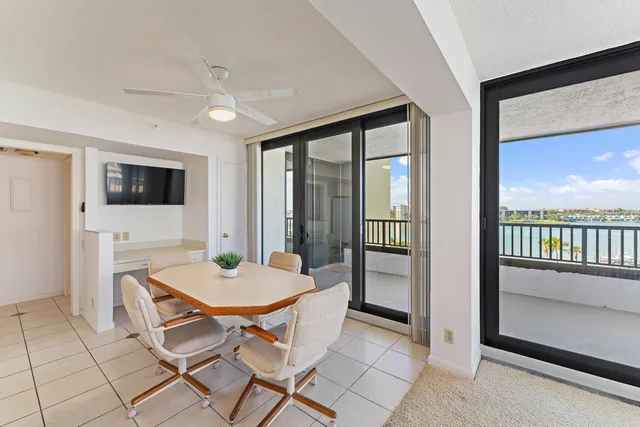 a spacious bedroom with a bed and a lamp