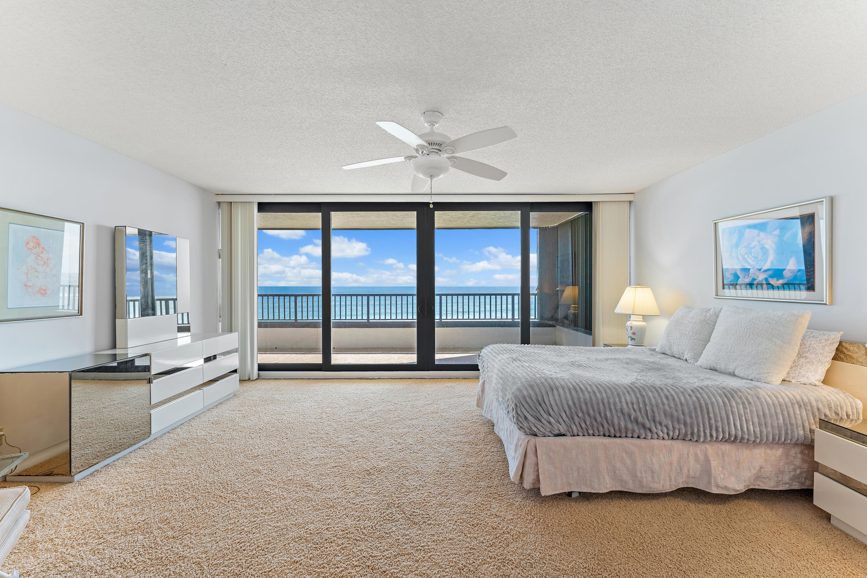 19900 South Beach Road, Unit 601 Jupiter, FL 33469 - Photo 41 of 84 a spacious bedroom with a large bed and a large window
