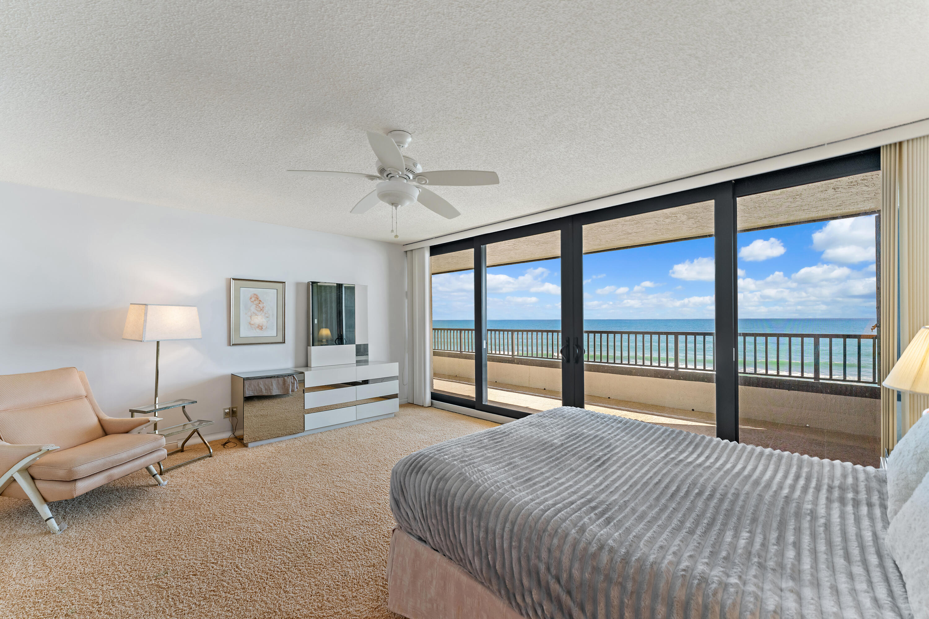 19900 South Beach Road, Unit 601 Jupiter, FL 33469 - Photo 42 of 84 a bedroom with a large bed and a large window