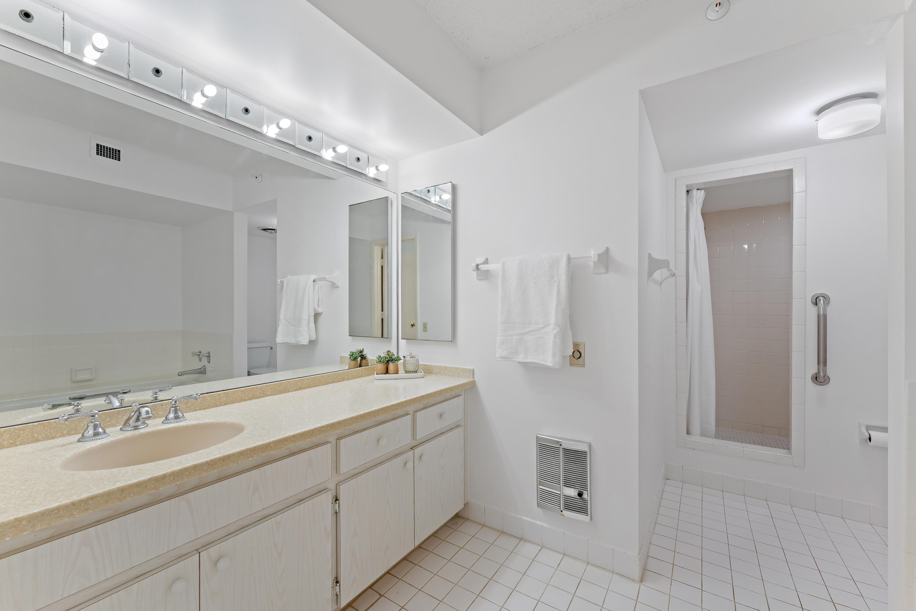 19900 South Beach Road, Unit 601 Jupiter, FL 33469 - Photo 52 of 84 a spacious bathroom with a double vanity sink mirror and shower