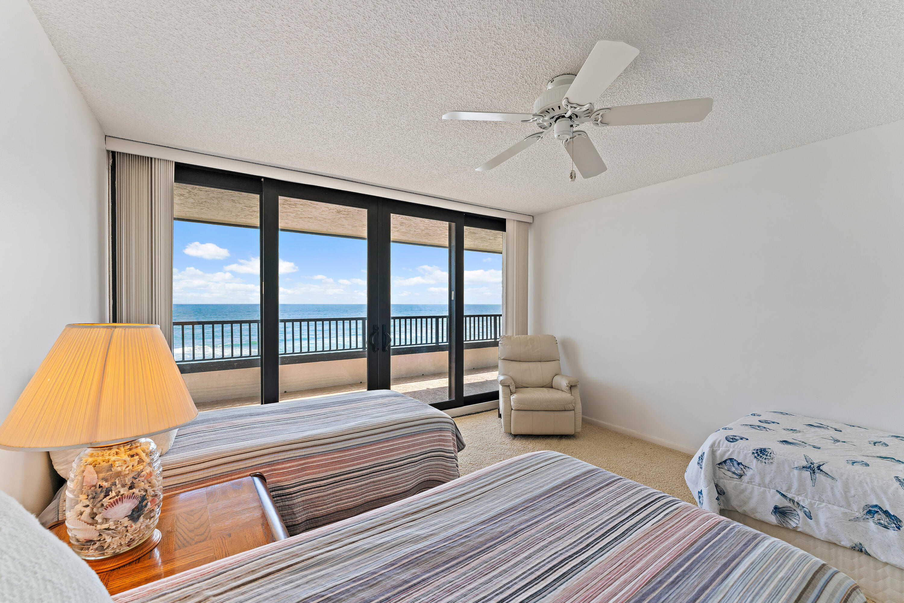 19900 South Beach Road, Unit 601 Jupiter, FL 33469 - Photo 57 of 84 a bedroom with a bed and wooden floor