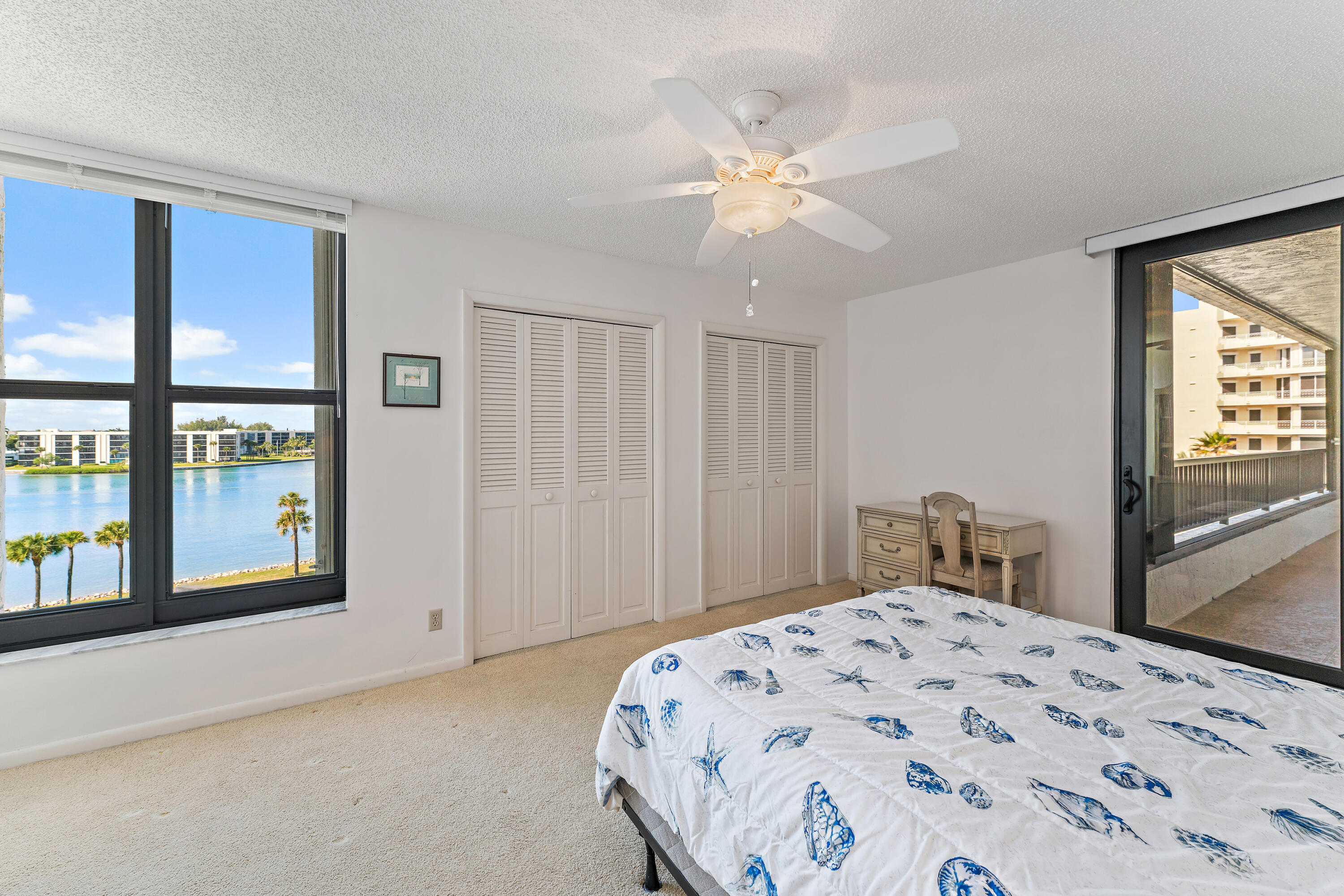 19900 South Beach Road, Unit 601 Jupiter, FL 33469 - Photo 60 of 84 a bedroom with a large bed and a window