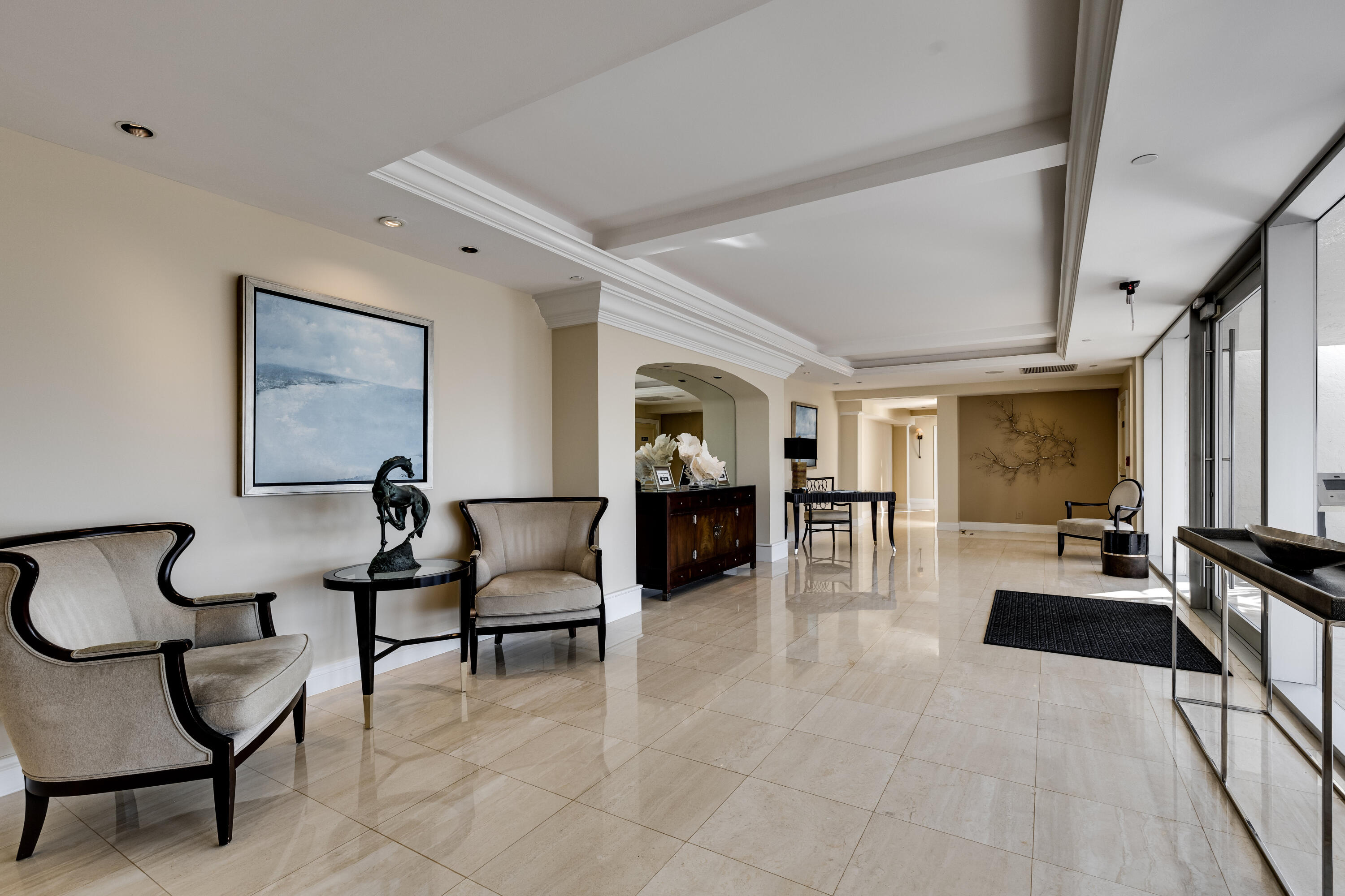 19900 South Beach Road, Unit 601 Jupiter, FL 33469 - Photo 75 of 84 a living room with furniture and a flat screen tv