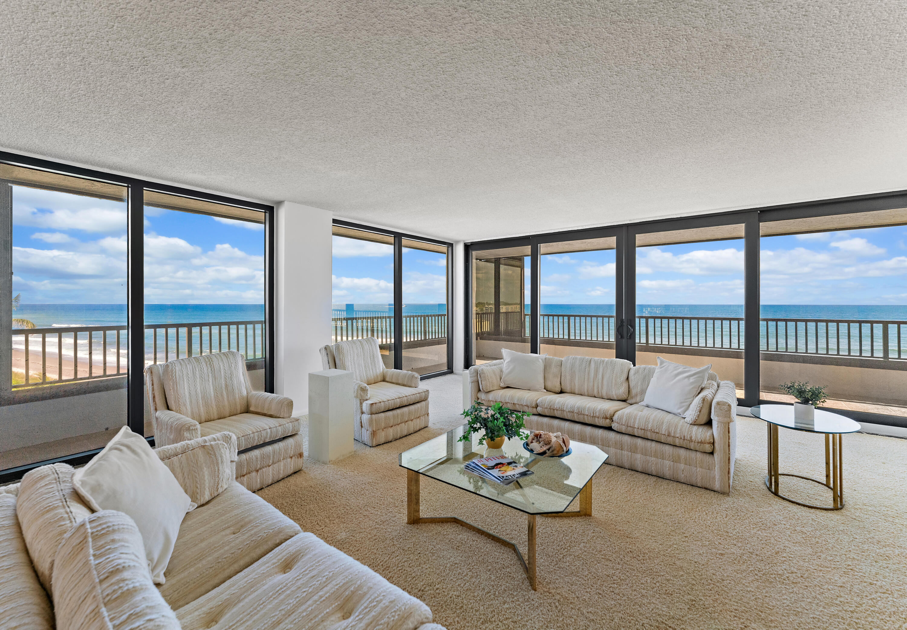 19900 South Beach Road, Unit 601 Jupiter, FL 33469 - Photo 8 of 84 a living room with furniture and a large window