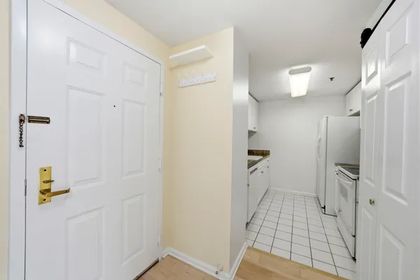 a view of a hallway with washer and dryer