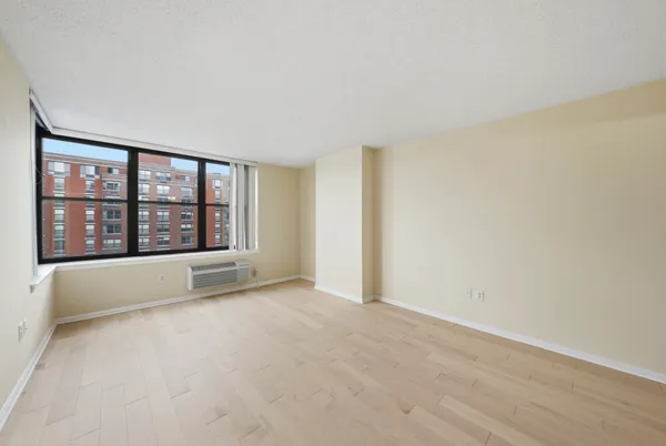 a view of an empty room with a window