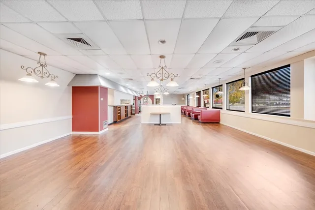 a living room with lots of furniture and a chandelier