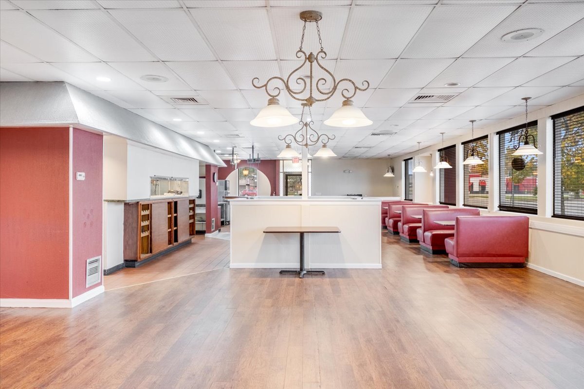 2312 West Springfield Avenue Champaign, IL 61821 - Photo 16 of 48 a living room with lots of furniture and a chandelier