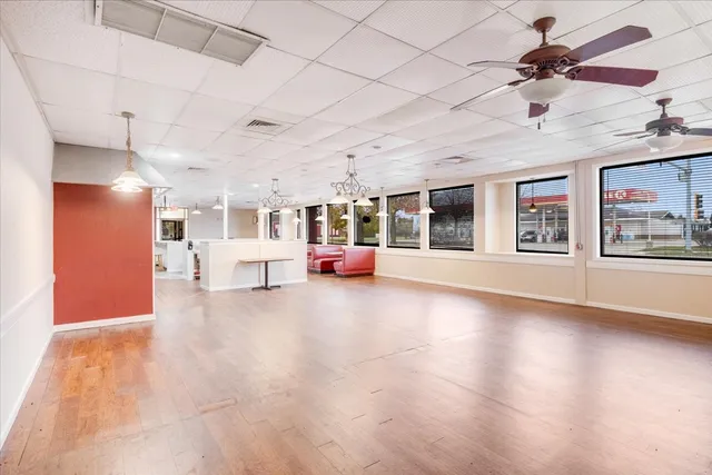 a living room with furniture a rug and a chandelier