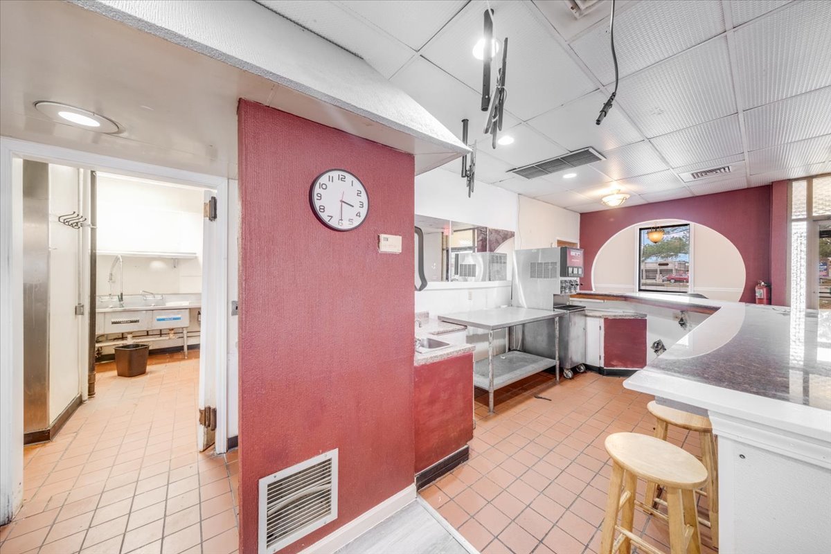 2312 West Springfield Avenue Champaign, IL 61821 - Photo 19 of 48 a living room with furniture a rug and a chandelier